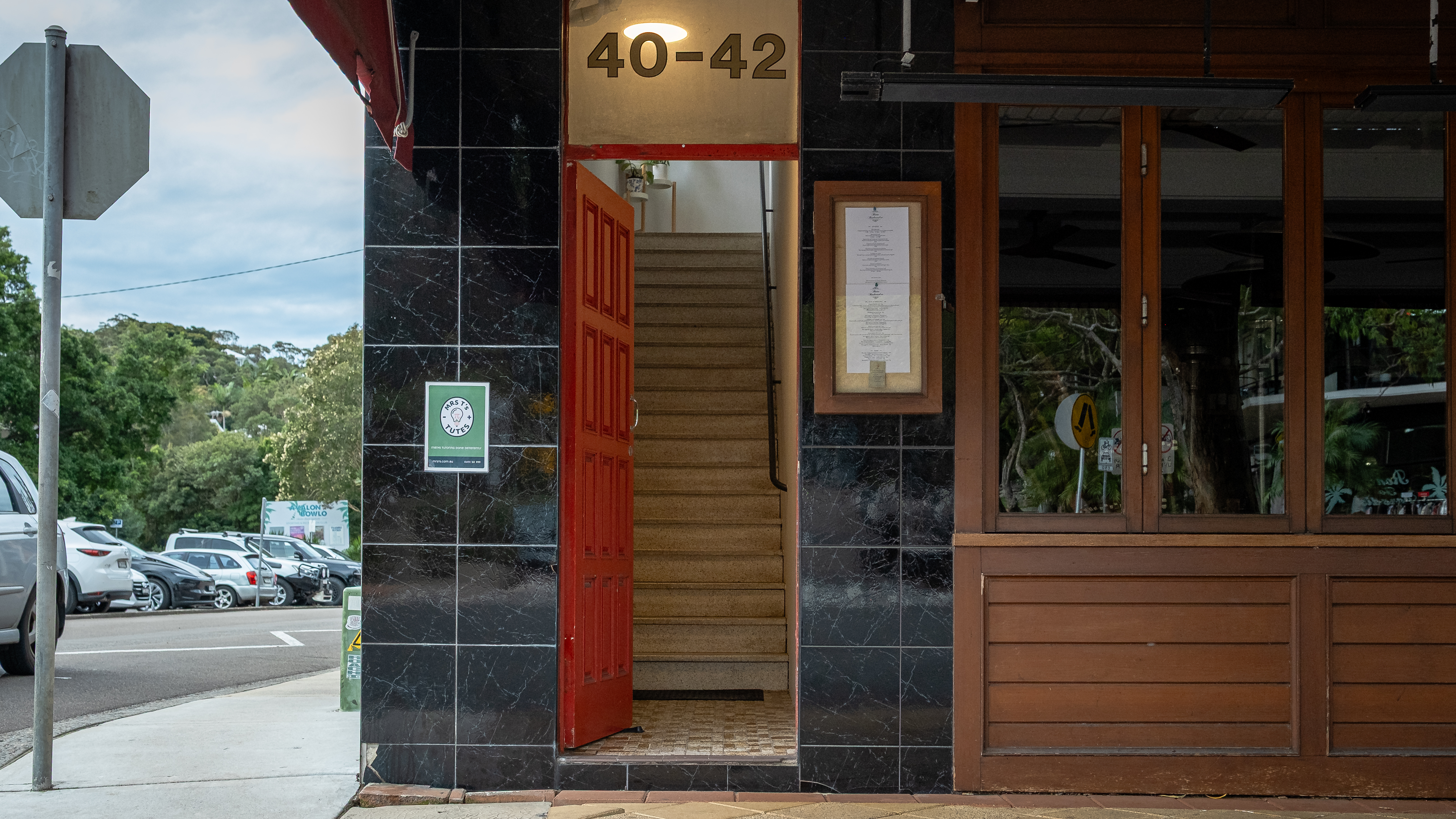 Mrs T's Tutes — red door on Avalon Pde