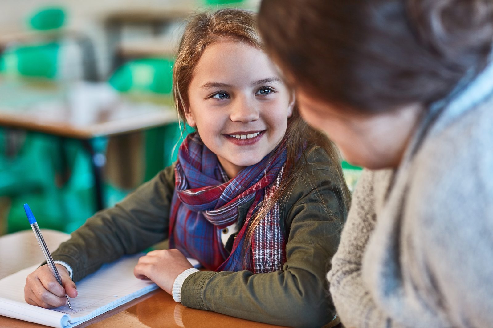 Girl learning maths with teacher